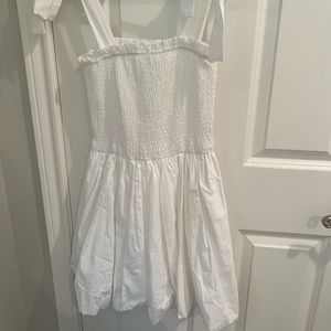 White smocked bubble dress with ties